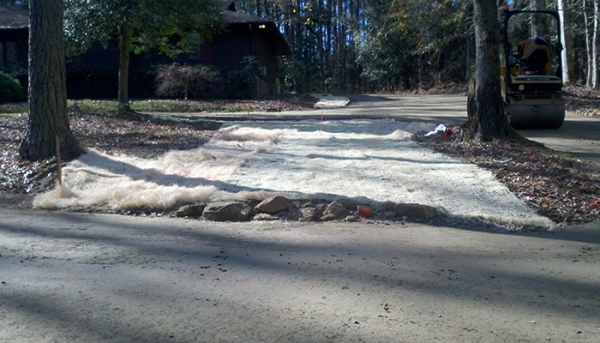 Erosion Control Matting to Slow Rushing Water and Prevent Erosion of Grass and Driveway
